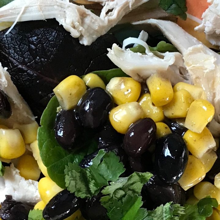 Easy, Healthy Southwest Chicken Salad - Chicken, Corn & Black Beans atop salad greens